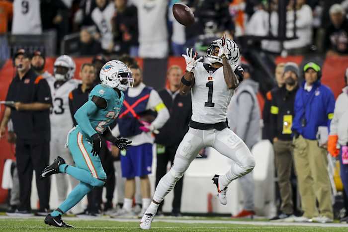Sep 29, 2022; Cincinnati, Ohio, USA; Cincinnati Bengals wide receiver Ja'Marr Chase (1) catches a pass against Miami Dolphins cornerback Keion Crossen (27) in the second half at Paycor Stadium. Mandatory Credit: Katie Stratman-USA TODAY Sports